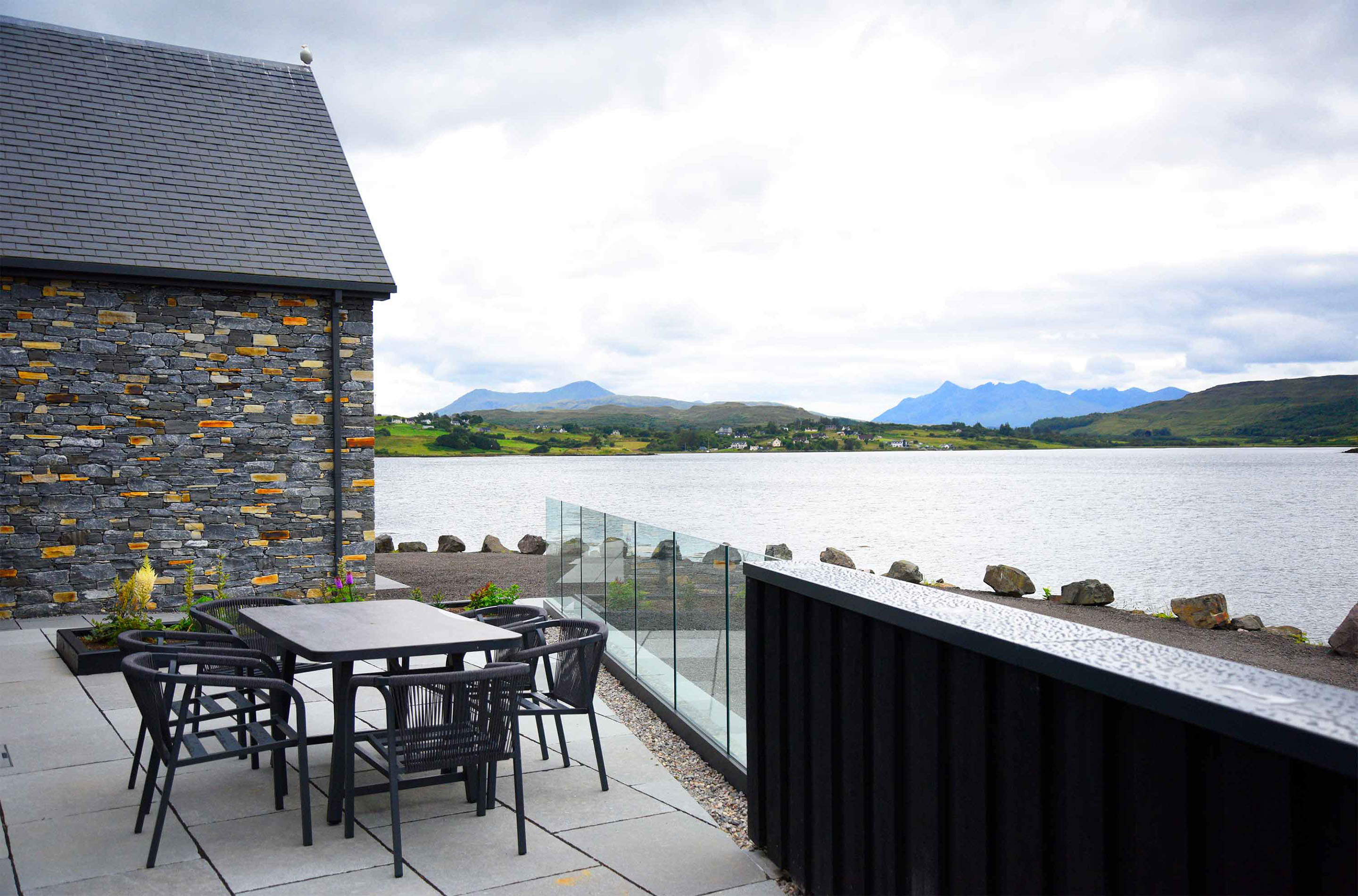 Stay in Portree Bay Fisherman's Cottage looks on to stunning sea and mountain views of Portree Bay