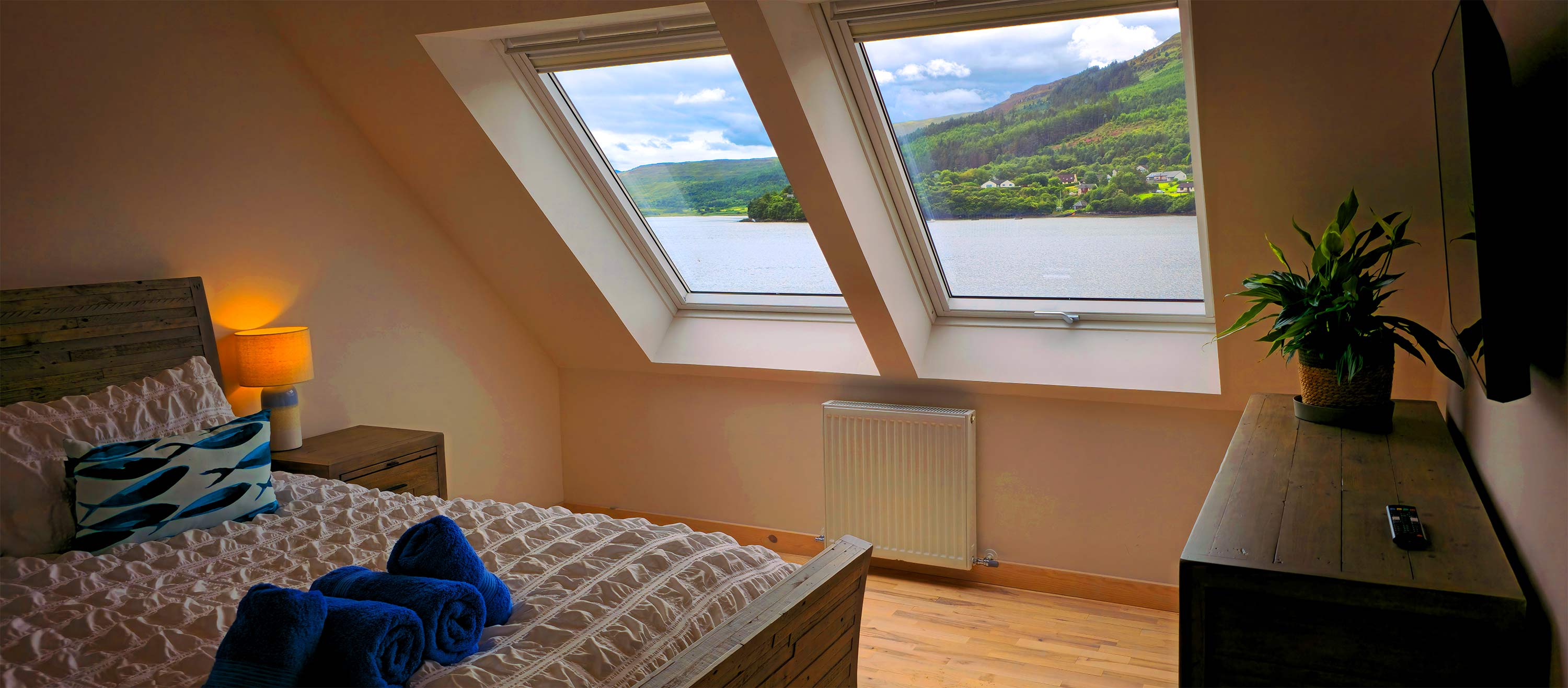 Stay at our Portree self catering accommodation with King size beds and en suite shower rooms and sea views of Loch Portree